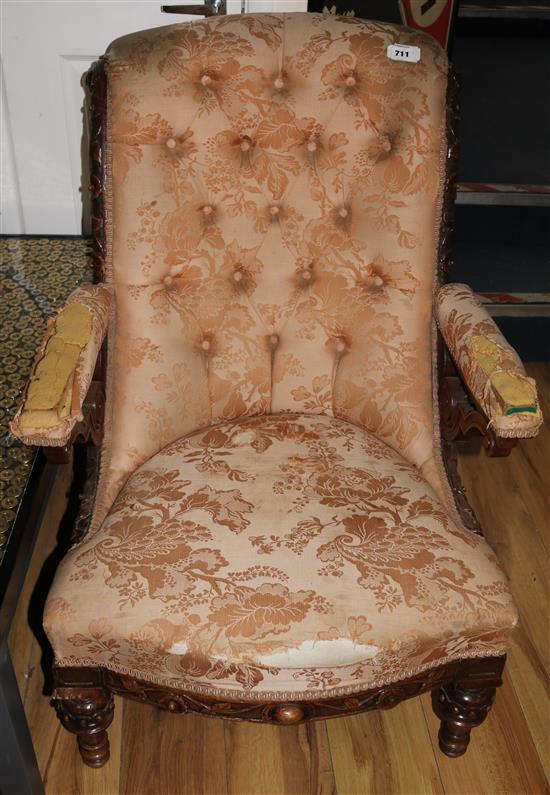 A Victorian carved walnut open armchair